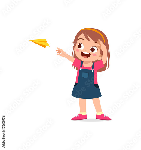 cute little girl play paper plane and feel happy