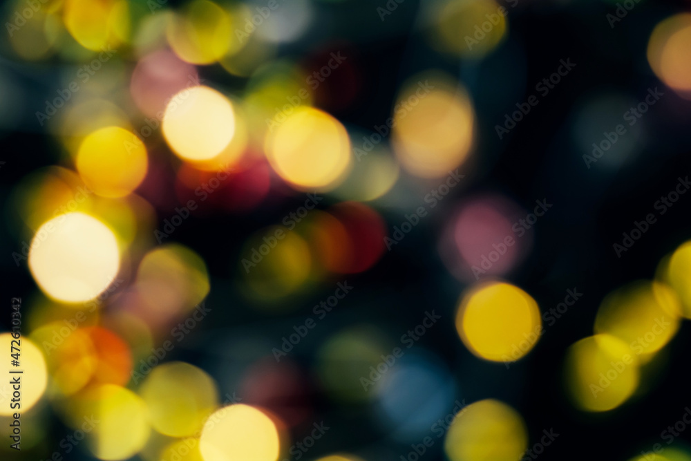 Obraz premium Festive abstract background, sparkling yellow and red bokeh. Copy space