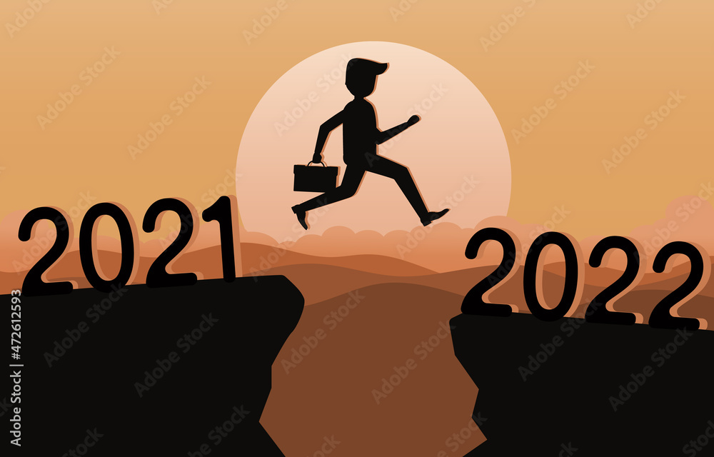 Silhouette of a businessman jumping high above two mountains 2021 to 2022. Concept of transition from 2021 to 2022. Going forward, Hopes, Goals, Overcoming, obstacles and problems. Silhouette of a businessman jumping high above two mountains 2021 to 2022. Concept of transition from 2021 to 2022. Going forward, Hopes, Goals, Overcoming, obstacles and problems.