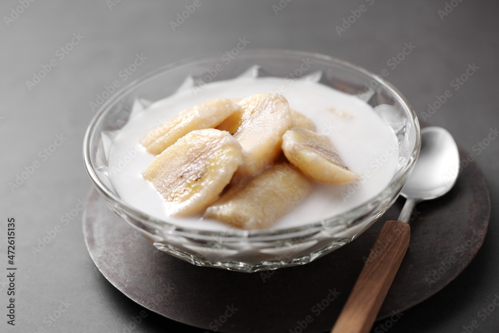Thai dessert from banana and coconut milk in glass cup Thai dessert from banana and coconut milk in glass cup
