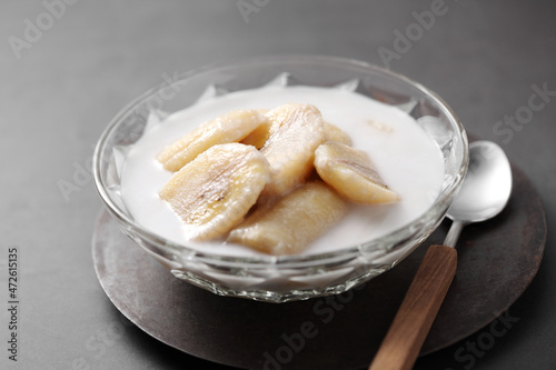 Thai dessert from banana and coconut milk in glass cup