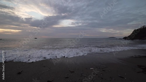 calm waves on beach morning sunrise sky horizon ultra wide photo