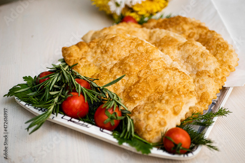 Juicy pasties with meat with a golden crust