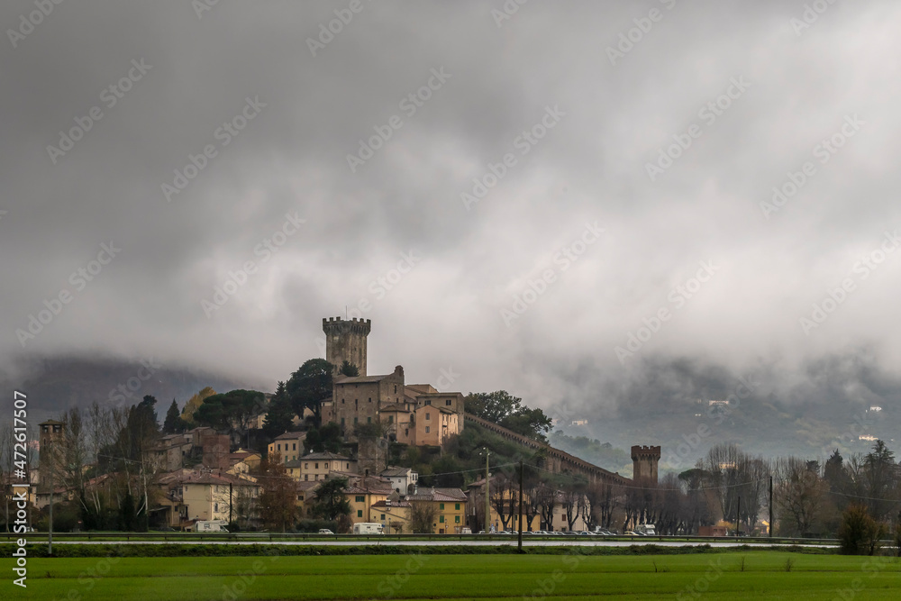 Panoramic view of Vicopisano, Italy, on a rainy and foggy winter day