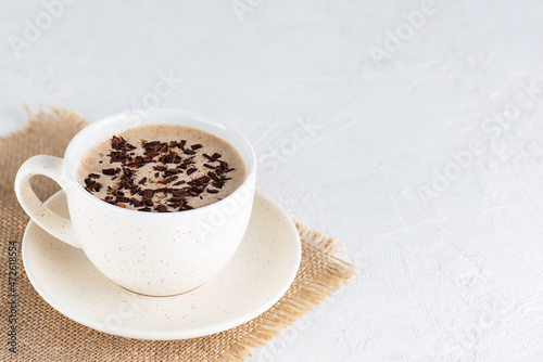 Chocolate mochaccino coffee with nuts in a mug. Horizontal orientation, copy space. photo