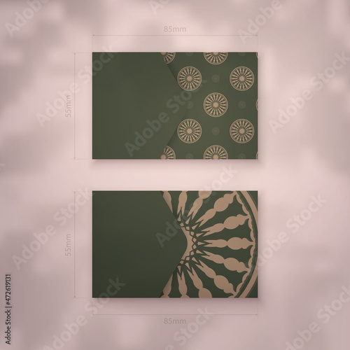 Presentable business card in green color with a mandala pattern in brown for your personality.