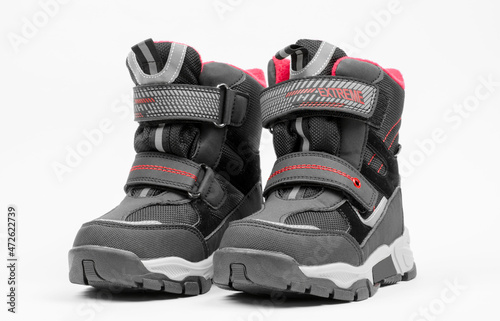 A pair of warm children's shoes. Children's winter boots on a light background.