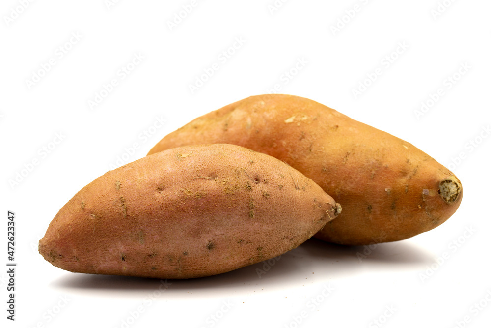 sweet potatoes on a white background. horizontal view. close up
