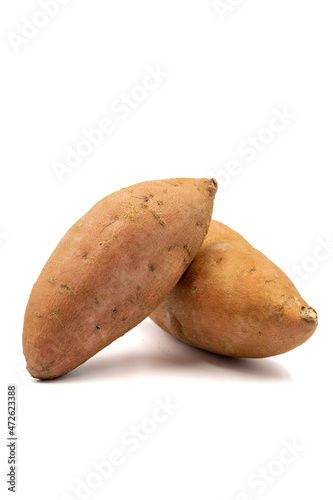 sweet potatoes on a white background. Vertical view. close up