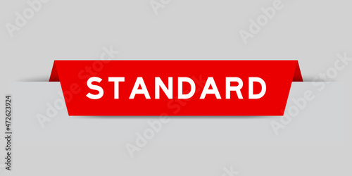 Red color inserted label with word standard on gray background
