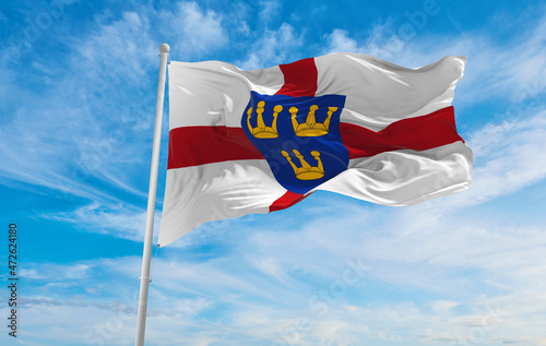 Foto flag of East Anglia  at cloudy sky background on sunset, panoramic view