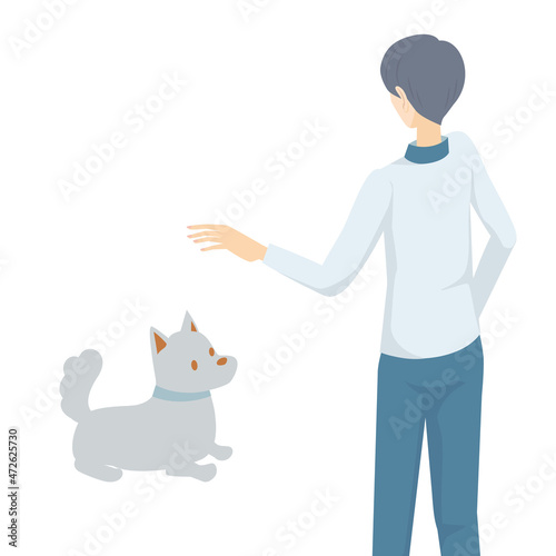 犬にしつけのトレーニングをする男性