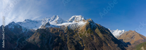 Scenic autumn mountain landscape with snow peaks, Tuymazinsky glacier, Digor Gorge, Northern Ossetia, Caucasus, Russia