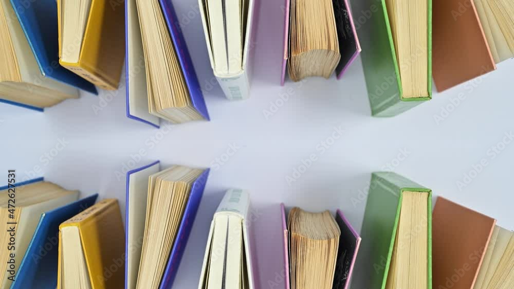 custom made wallpaper toronto digitalHardcovered vintage books appear on white theme. Stop motion