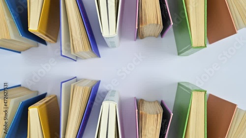 Wallpaper Mural Hardcovered vintage books appear on white theme. Stop motion Torontodigital.ca