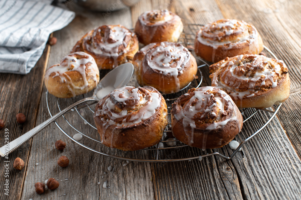 Cinnamon rolls with hazelnut filling on a cooling rack Cinnamon rolls with hazelnut filling on a cooling rack