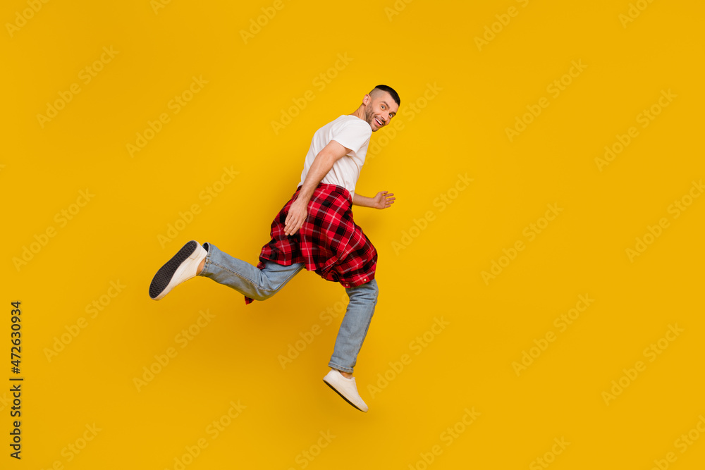 Full length body size photo man jumping running on sale isolated bright yellow color background