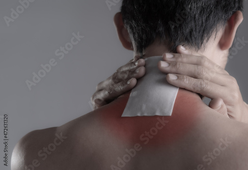 Billede på lærred Medicated pain relief patch with man pain shoulders,office syndrome,Health problems from overworked concept