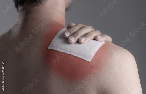 Obraz na plátne Medicated pain relief patch with man pain shoulders,office syndrome,Health problems from overworked concept