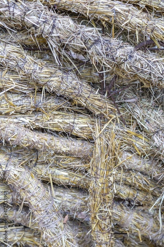 Straw plaited in braids as a decorative element of a garden or backyard