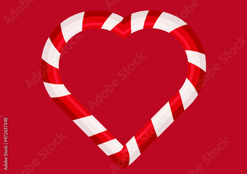 Bastón de caramelo de navidad en fondo rojo.