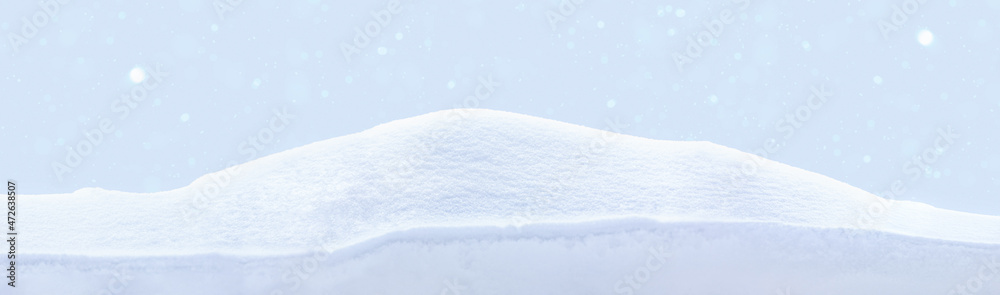 Snowy white clean snow texture. Snowdrift on blue background.