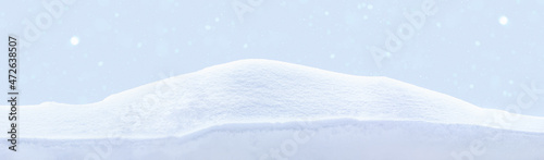 Snowy white clean snow texture. Snowdrift on blue background.