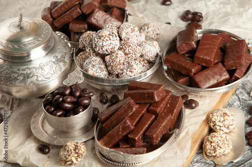 New Year's Eve table full of chocolates for children. Chocolate candy isolated 