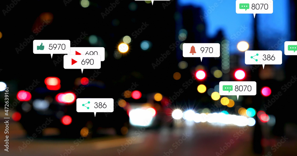 Image of social media icons and numbers over road traffic and cityscape Image of social media icons and numbers over road traffic and cityscape