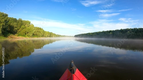 Travel landscape with kayak on river with small fog. Boating team