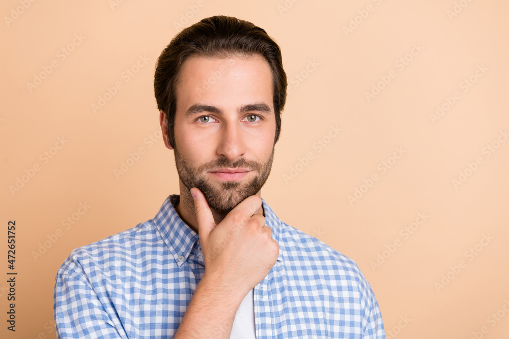 Photo of millennial guy bossy hand face wear blue shirt isolated on beige color background Photo of millennial guy bossy hand face wear blue shirt isolated on beige color background