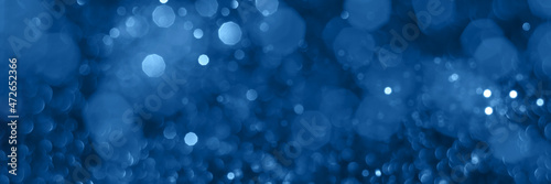 Blue sparkling glitter bokeh background, christmas texture. Holiday lights. Abstract defocused header. Wide screen wallpaper. Panoramic web banner with copy space for design