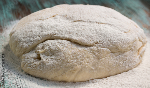 Fresh dough mixed and kneaded from white wheat flour before baking