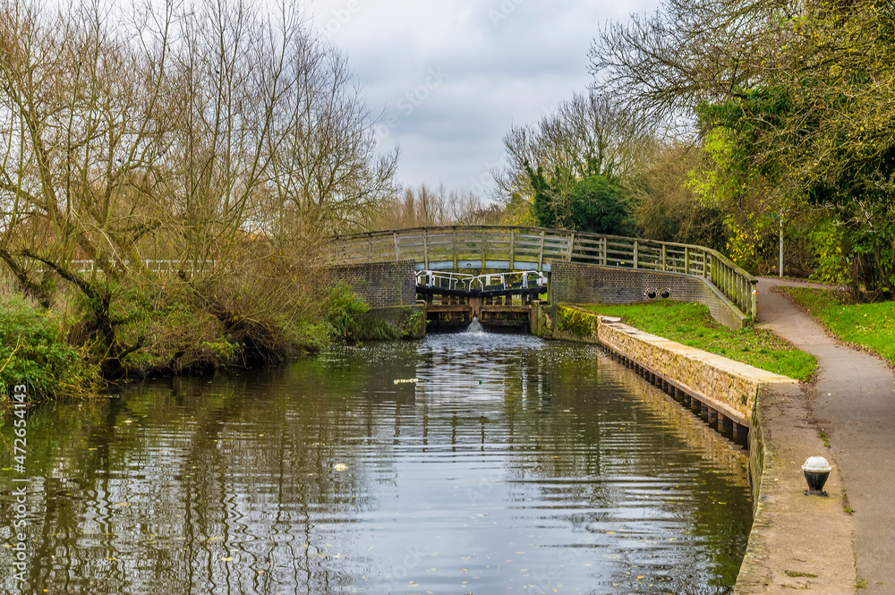 The view of a set of locks on the Grand Union canal in Syston UK on an Autumn day