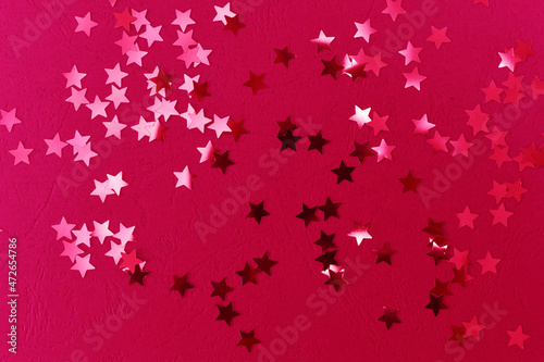 Glittering stars. Colorful celebration background. Flat lay. new year, christmas, top view, colored background, festive background