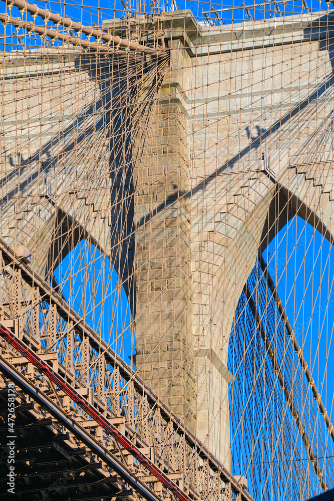 Obraz premium Travel to New York. The skyline of Manhattan photographed during a summer sunrise, view to Brooklyn Bridge. Landmarks of United States of America. Skyscraper office buildings.