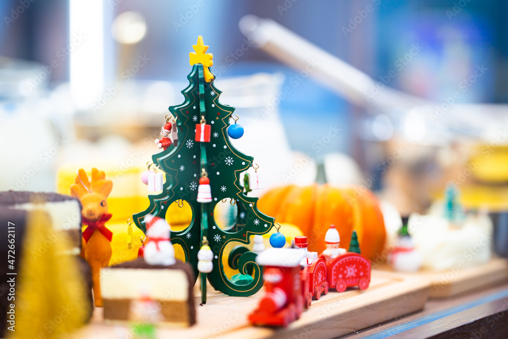 Christmas Tree wood toy decorate in display mirror box in Cheese Cake shop.