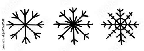 A set of three black different hand draw snowflake icons. Illustration isolated on background.