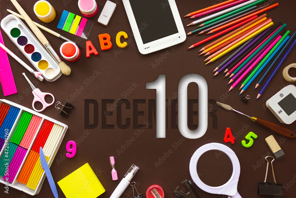 December 10th. Day 10 of month, Calendar date. School notebook and various stationery with calendar day. School and office supplies frame. Winter month, day of the year concept. December 10th. Day 10 of month, Calendar date. School notebook and various stationery with calendar day. School and office supplies frame. Winter month, day of the year concept.