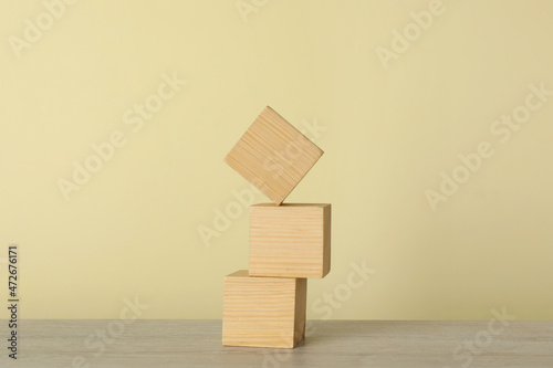 Fototapeta Naklejka Na Ścianę i Meble -  Stack of wooden cubes on table. Harmony and balance concept
