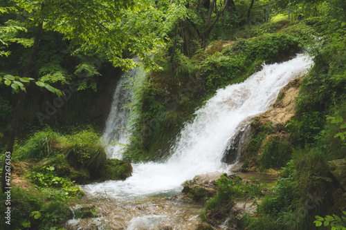 Waterfall Gostilje falling from rock in Zlatibor resort of Serbia photo