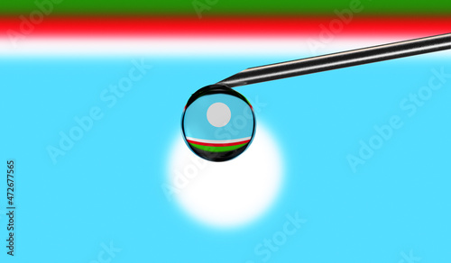 Vaccine syringe with drop on needle against national flag of Sakha Republic background. Medical concept vaccination. Coronavirus Sars-Cov-2 pandemic protection. National safety idea.