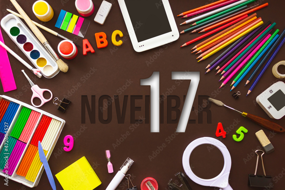 November 17th. Day 17 of month, Calendar date. School notebook and various stationery with calendar day. School and office supplies frame. Autumn month, day of the year concept. November 17th. Day 17 of month, Calendar date. School notebook and various stationery with calendar day. School and office supplies frame. Autumn month, day of the year concept.