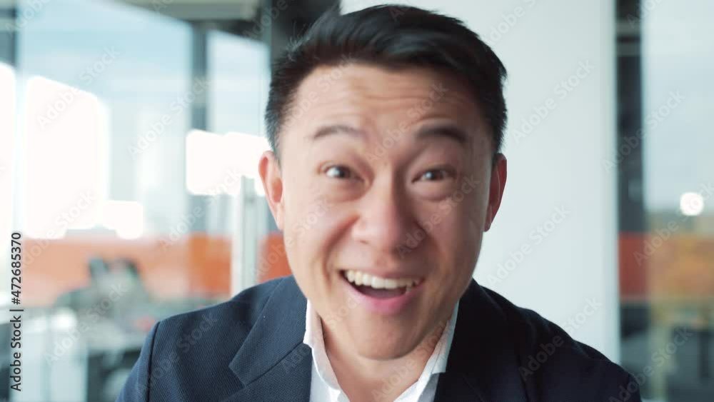 surprised asian business man shoots glasses shocked looking at camera. Happy smiling rejoices. Look at monitor screen webcam view. amazed close up portrait. Face Handsome Office worker wow expression surprised asian business man shoots glasses shocked looking at camera. Happy smiling rejoices. Look at monitor screen webcam view. amazed close up portrait. Face Handsome Office worker wow expression