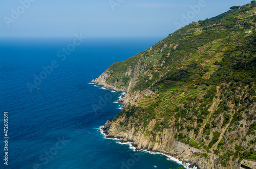 Cinque Terre National Park coastline south of Riomaggiore, Cinque Terre, Italy. © Danita Delimont