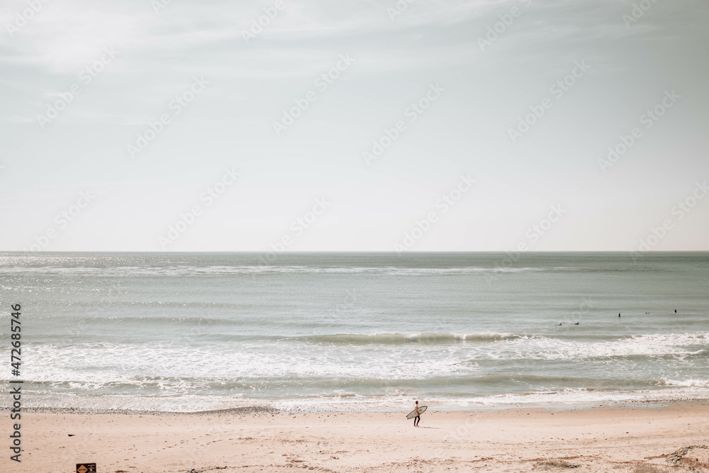 man with surfboard at beach