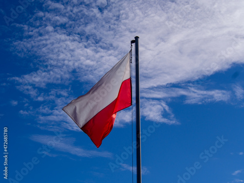 Poland flag isolated on the blue sky