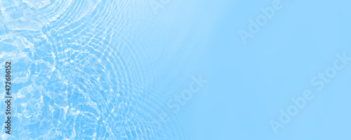 Fresh water background. Bright blue pattern with natural rippled water texture. Web banner with copy space. Cosmetic water surface background. Hydration concept, drinking