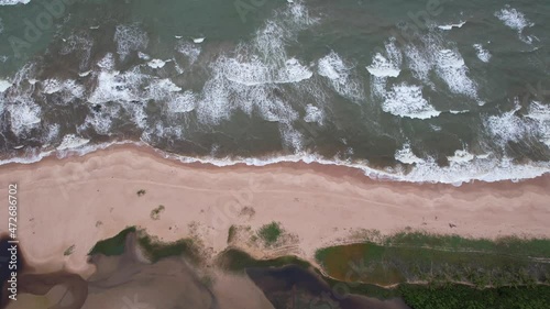 Aerial view of Imbassai beach, Bahia, Brazil. Beautiful beach in the northeast with a river and palm trees. photo