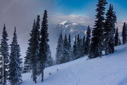 Ski slopes of Revelstoke Mountain Resort, British Columbia, Canada and view across valley